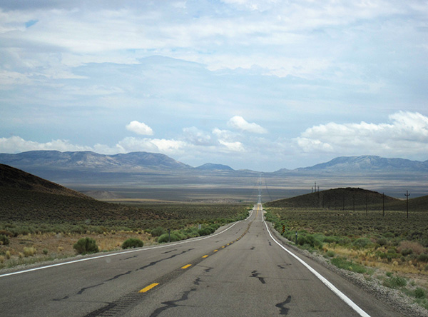 Sweeping view of plain and road running to the horizon